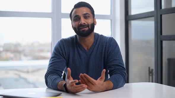 Video Meeting with a Happy Indian Man Cheerful Guy Waving and Looking at the Camera alt