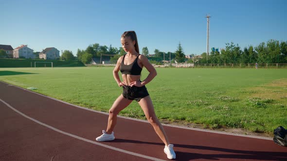 Young Woman Rolling From Side to Side alt