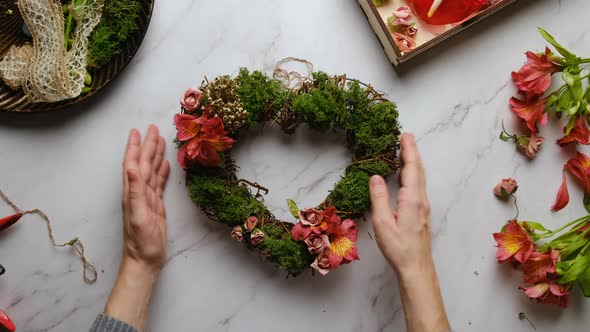 Hands Decorates Diy Floral Wreath for Valentines Day alt
