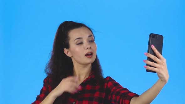 Lady Making Selfie and with Duckface on Her Phone. Slow Motion alt