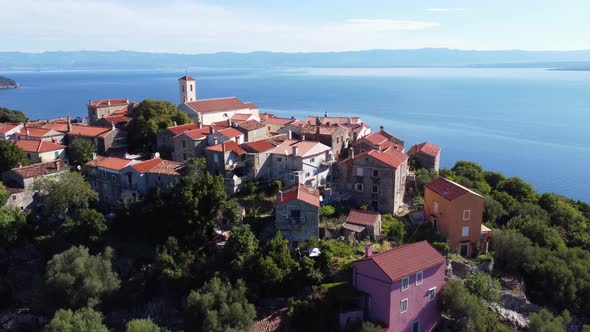 Aerial shot of a medieval town at the coastline in Croatia.