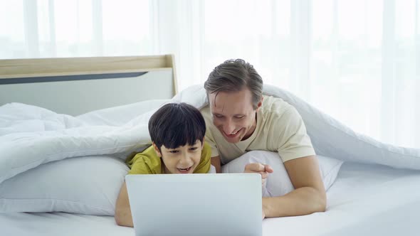 Happy smiling business blonde, man. Freelance working from home watching movie alt