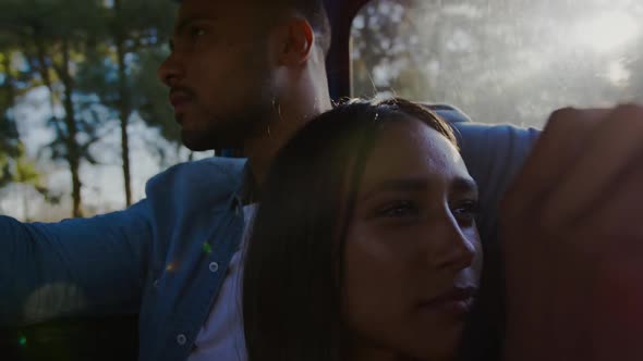 Young couple on a road trip in their pick-up truck alt