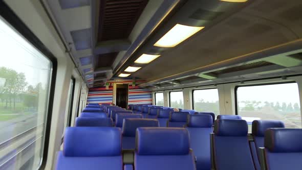Empty Interior of a Passenger Train Car in Motion
