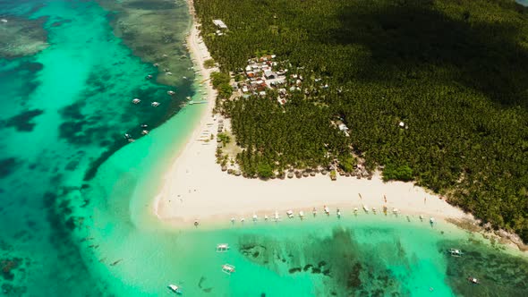 Tropical Daco Island with a Sandy Beach and Tourists alt