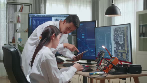 Asian Team Of Multi Engineers, Scientists Work On Tablet And Computer, Talk, Design Pcb alt