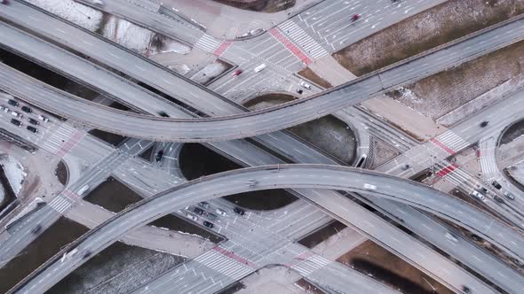 Aerial Time Lapse Traffic Jam Interchange Road Drone Shot Top Down Zoom Out View Roadway alt