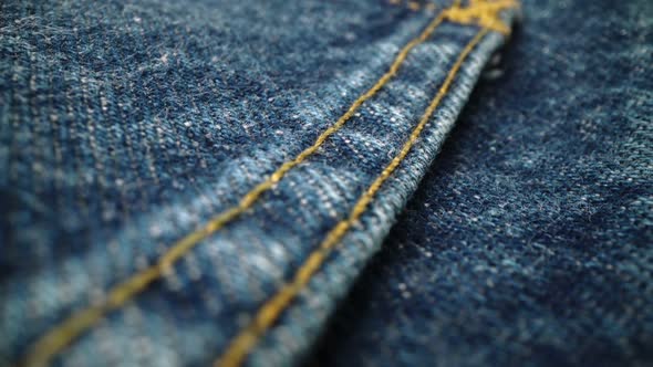 Extreme Detailed of Blue Denim Jeans Texture in Dolly Shot Over Cloth Surface alt
