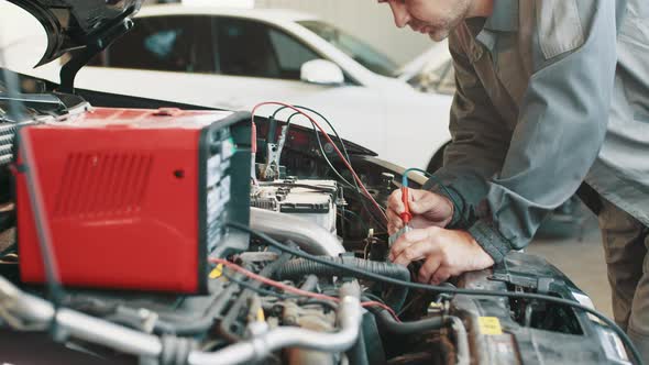Professional Car Mechanic Working in Auto Repair Service alt