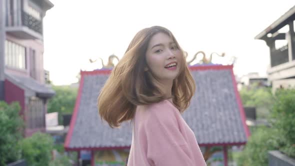 Asian tourist woman feeling happy traveling in Beijing ,Lifestyle backpack tourist travel holiday. alt