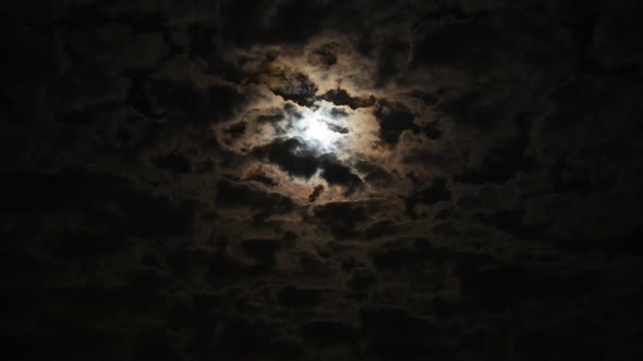 Time-Lapse of Clouds in the Night Sky Against the Background of a Bright Full Moon