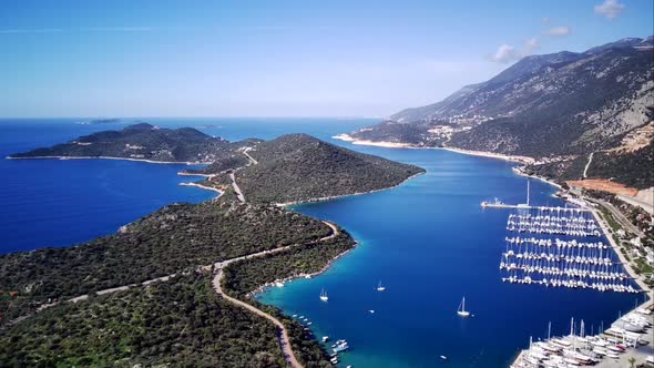 The top view from the drone of Kas resorts, bay with yahts and city in Mugla province of Turkey alt