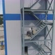 Aerial view of Welder With Mask Welding metal stairs - VideoHive Item for Sale