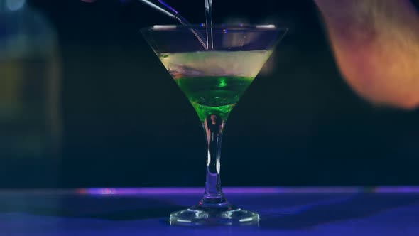 Barman Making Cocktail in Club