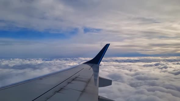 Beautiful flight on an airplane. View from the window of the plane on the clouds.