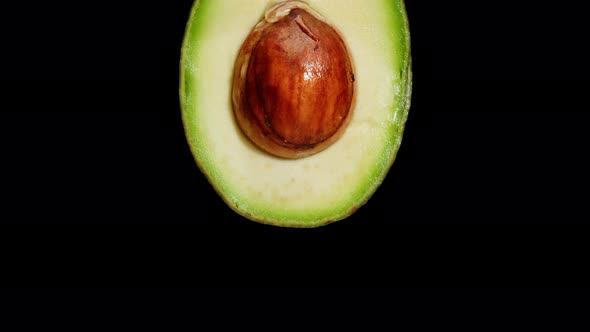 Avocado Half Isolated on Black Background Chroma Key Fresh Sliced Avocado Closeup alt