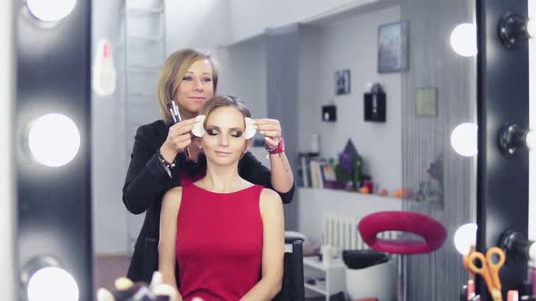 Makeup Artist Removing White Patches for Skin Protection From Model's Skin alt