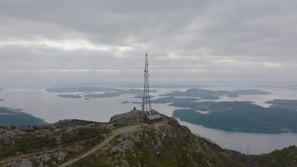 Mast tower, antennas for transmission mobile telecommunication signal on top of hill - Aerial birds alt