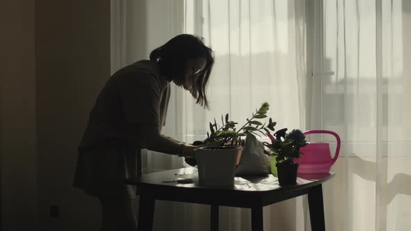 Girl Planting Home Flowers