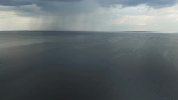 Aarial View of Rain Above Pond.