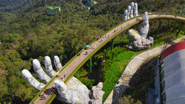 Aerial Shot of the Golden Bridge in the City of Danang alt