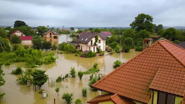 Aerial view of flooded houses with dirty water of Dnister river in Halych town, western Ukraine. alt