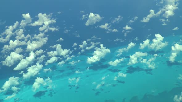 Flying over The Bahamas. Beautiful ocean colors. Actual aerial footage