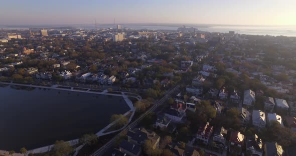 Aerial Flyover of Downtown Charleston SC and Colonial Lake in Early Morning