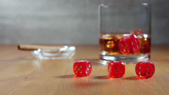 Whiskey and Dice on a Wooden Table