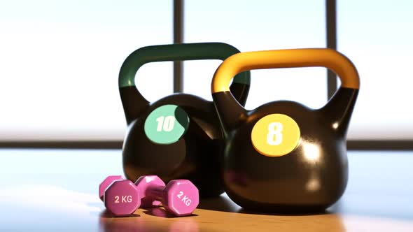 Heavy steel Kettlebells And Dumbbells on the modern gym floor. Fitness, aerobics alt