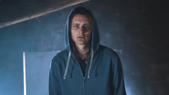 Portrait of Drug Addict Man Walking in Abandoned Place alt