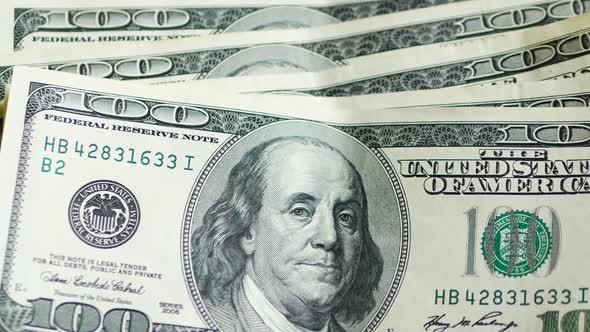 Stack of hundred dollars bills alt