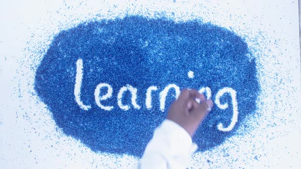 South Asian Hand Writes On Blue Learning