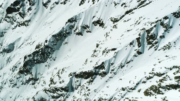 Snowy High Altitude Mountain Surface From Above