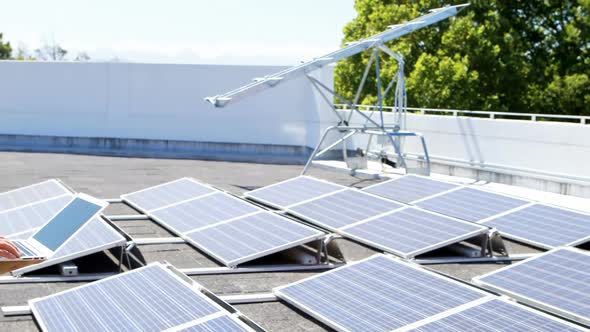 Male worker using laptop at solar station 4k alt