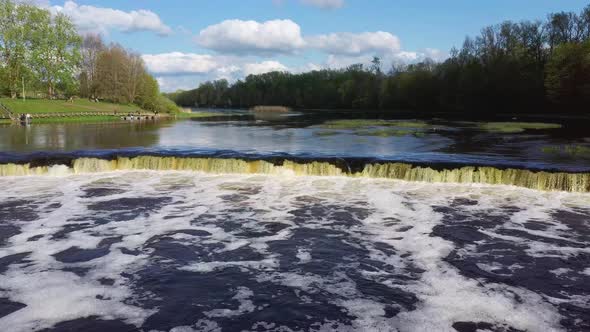 Flying Fish at Ventas Rumba Waterfall. The Widest Waterfall in Europe in Latvia Kuldiga Also Called alt