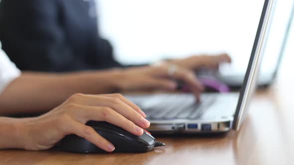 People Working In The Business Office Use Laptops