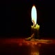 A single green candle burning.Isolated candle burning with dark background. - VideoHive Item for Sale
