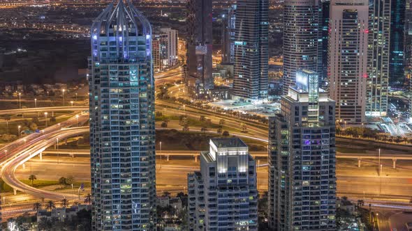 Dubai Marina Skyscrapers and Jumeirah Lake Towers View From the Top Aerial Night Timelapse in the alt