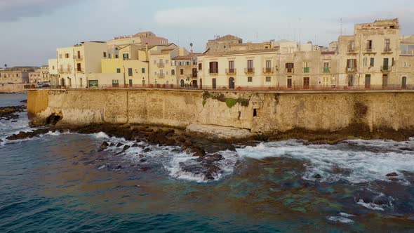 View of the Embankment of the Island of Ortigia During Sunrise. Bird's Eye View. Sicily. Italy
