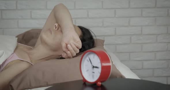 Worried woman night.  alt