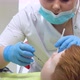 Closeup of Female Dentist Treating Little Boy in Dental Clinic - VideoHive Item for Sale
