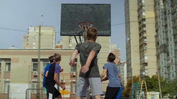 Streetball Teenager Missing a Free Throw Outdoors alt