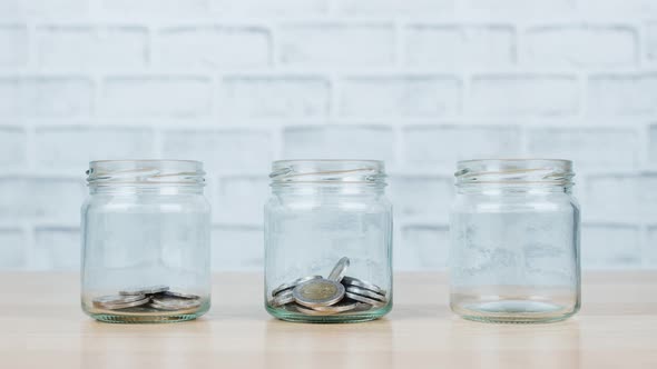 Stop motion animation Money on glass jar is present to concept saving money. 