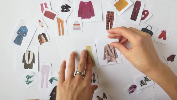 The Stylist Selects a Wardrobe Using the Example of Paper Decorations