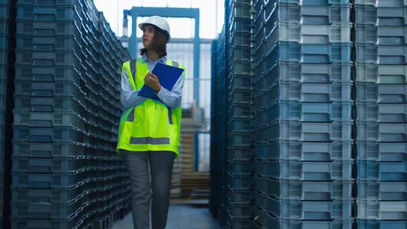 Focused Storekeeper Checking Boxes Analysing Pallets Before Shipping Delivery alt