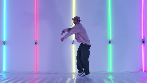 Dancing Man Young Talented Street Dancer Performing Freestyle Hip Hop Moves Against Bright Neon alt
