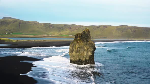 Iceland. Colorful warm sunset over the sea and volcanic basalt rocks. alt
