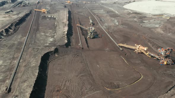 Flight Over the Quarry with Heavy Bucket Wheel Excavators Mining a Coal alt