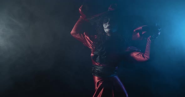 Gorgeous Young Woman Wearing Old Red Dress Posing in the Smoke Santa Muerte alt